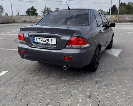 Серый Мицубиси Лансер, объемом двигателя 1.58 л и пробегом 250 тыс. км за 4300 $, фото 11 на Automoto.ua