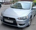 Серый Мицубиси Лансер, объемом двигателя 2 л и пробегом 165 тыс. км за 6000 $, фото 1 на Automoto.ua