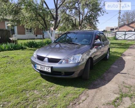 Сірий Міцубісі Lancer, об'ємом двигуна 1.58 л та пробігом 92 тис. км за 6700 $, фото 11 на Automoto.ua