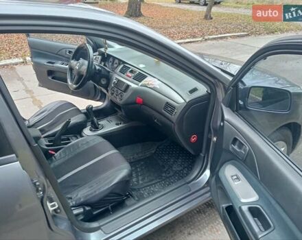 Серый Мицубиси Лансер, объемом двигателя 1.58 л и пробегом 205 тыс. км за 3300 $, фото 9 на Automoto.ua