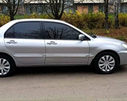 Серый Мицубиси Лансер, объемом двигателя 1.58 л и пробегом 176 тыс. км за 5000 $, фото 9 на Automoto.ua