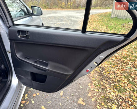 Сірий Міцубісі Lancer, об'ємом двигуна 2 л та пробігом 225 тис. км за 6890 $, фото 14 на Automoto.ua