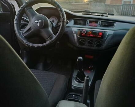 Серый Мицубиси Лансер, объемом двигателя 1.6 л и пробегом 234 тыс. км за 4300 $, фото 8 на Automoto.ua