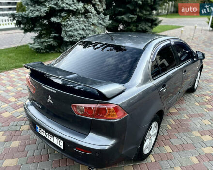 Серый Мицубиси Лансер, объемом двигателя 2 л и пробегом 212 тыс. км за 6000 $, фото 9 на Automoto.ua