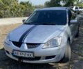 Сірий Міцубісі Lancer, об'ємом двигуна 1.6 л та пробігом 283 тис. км за 2600 $, фото 2 на Automoto.ua