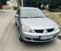 Серый Мицубиси Лансер, объемом двигателя 1.58 л и пробегом 166 тыс. км за 5000 $, фото 1 на Automoto.ua