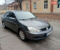 Серый Мицубиси Лансер, объемом двигателя 1.58 л и пробегом 205 тыс. км за 3300 $, фото 1 на Automoto.ua