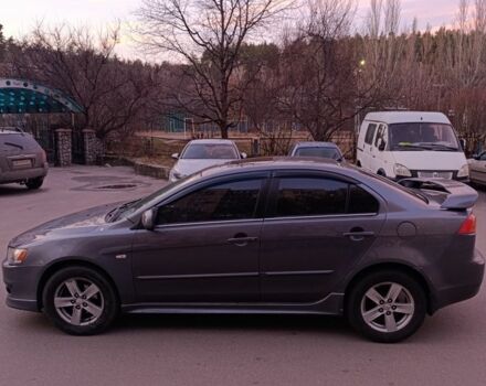 Серый Мицубиси Лансер, объемом двигателя 2 л и пробегом 345 тыс. км за 6500 $, фото 2 на Automoto.ua