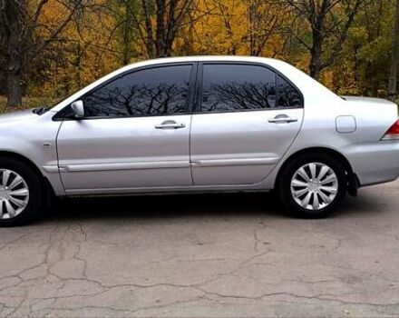 Серый Мицубиси Лансер, объемом двигателя 1.58 л и пробегом 176 тыс. км за 5000 $, фото 11 на Automoto.ua