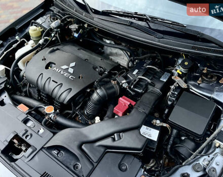 Серый Мицубиси Лансер, объемом двигателя 2 л и пробегом 212 тыс. км за 6000 $, фото 29 на Automoto.ua