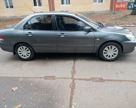 Серый Мицубиси Лансер, объемом двигателя 1.58 л и пробегом 205 тыс. км за 3300 $, фото 4 на Automoto.ua