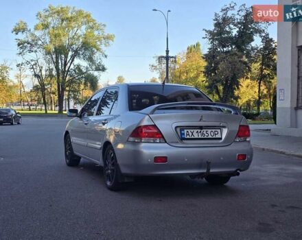 Серый Мицубиси Лансер, объемом двигателя 1.58 л и пробегом 150 тыс. км за 5200 $, фото 3 на Automoto.ua