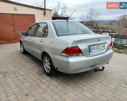 Серый Мицубиси Лансер, объемом двигателя 1.58 л и пробегом 185 тыс. км за 4700 $, фото 7 на Automoto.ua