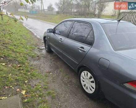 Сірий Міцубісі Lancer, об'ємом двигуна 1.58 л та пробігом 298 тис. км за 3400 $, фото 5 на Automoto.ua