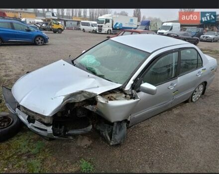 Серый Мицубиси Лансер, объемом двигателя 1.6 л и пробегом 260 тыс. км за 1200 $, фото 1 на Automoto.ua