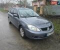 Сірий Міцубісі Lancer, об'ємом двигуна 1.58 л та пробігом 298 тис. км за 3400 $, фото 1 на Automoto.ua