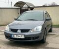 Серый Мицубиси Лансер, объемом двигателя 1.6 л и пробегом 180 тыс. км за 4700 $, фото 1 на Automoto.ua