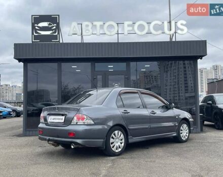 Серый Мицубиси Лансер, объемом двигателя 1.58 л и пробегом 146 тыс. км за 5490 $, фото 7 на Automoto.ua