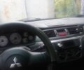 Серый Мицубиси Лансер, объемом двигателя 1.6 л и пробегом 130 тыс. км за 3700 $, фото 1 на Automoto.ua