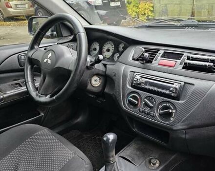 Сірий Міцубісі Lancer, об'ємом двигуна 1.58 л та пробігом 200 тис. км за 1700 $, фото 15 на Automoto.ua