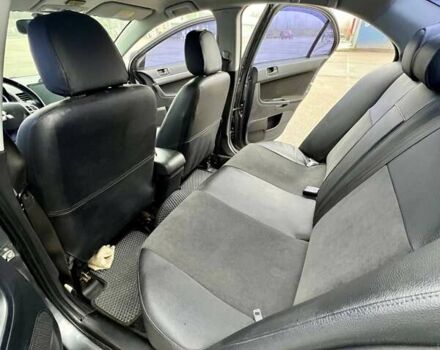 Серый Мицубиси Лансер, объемом двигателя 2 л и пробегом 203 тыс. км за 4999 $, фото 11 на Automoto.ua