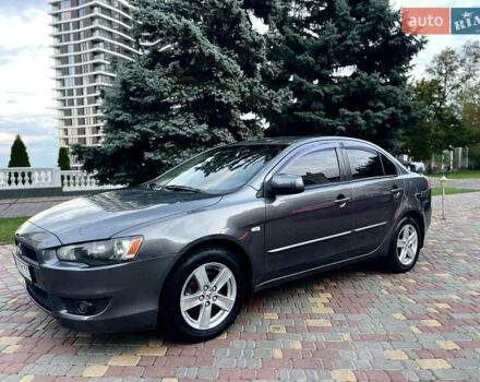 Серый Мицубиси Лансер, объемом двигателя 2 л и пробегом 212 тыс. км за 6000 $, фото 3 на Automoto.ua