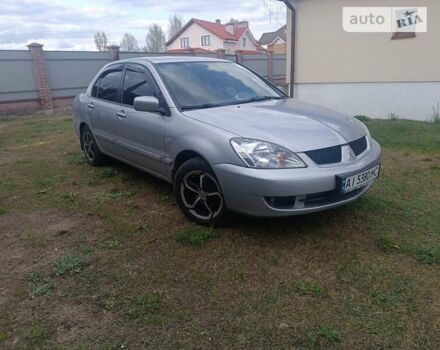 Сірий Міцубісі Lancer, об'ємом двигуна 1.6 л та пробігом 129 тис. км за 6000 $, фото 5 на Automoto.ua