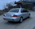 Сірий Міцубісі Lancer, об'ємом двигуна 1.58 л та пробігом 180 тис. км за 3900 $, фото 3 на Automoto.ua
