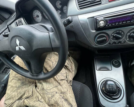 Серый Мицубиси Лансер, объемом двигателя 1.58 л и пробегом 183 тыс. км за 3800 $, фото 38 на Automoto.ua