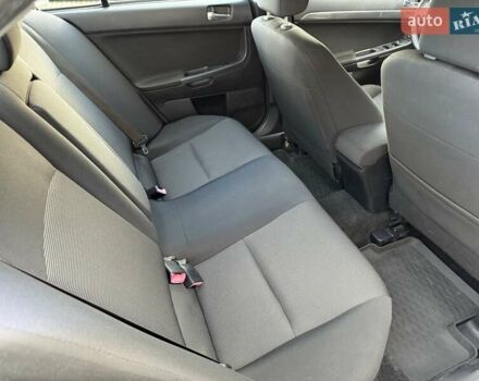 Серый Мицубиси Лансер, объемом двигателя 2 л и пробегом 230 тыс. км за 6900 $, фото 28 на Automoto.ua