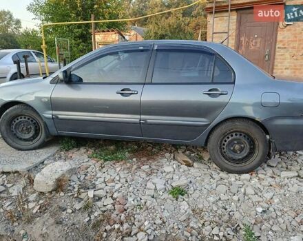 Серый Мицубиси Лансер, объемом двигателя 1.6 л и пробегом 234 тыс. км за 4300 $, фото 3 на Automoto.ua