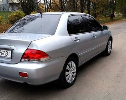 Серый Мицубиси Лансер, объемом двигателя 1.58 л и пробегом 176 тыс. км за 5000 $, фото 5 на Automoto.ua