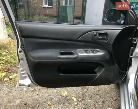 Сірий Міцубісі Lancer, об'ємом двигуна 1.58 л та пробігом 240 тис. км за 4299 $, фото 19 на Automoto.ua