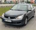 Серый Мицубиси Лансер, объемом двигателя 1.6 л и пробегом 212 тыс. км за 5200 $, фото 1 на Automoto.ua