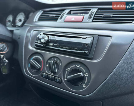 Серый Мицубиси Лансер, объемом двигателя 1.58 л и пробегом 34 тыс. км за 7500 $, фото 38 на Automoto.ua