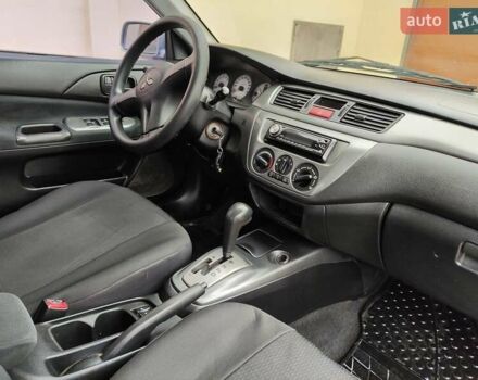 Серый Мицубиси Лансер, объемом двигателя 1.58 л и пробегом 185 тыс. км за 4700 $, фото 9 на Automoto.ua