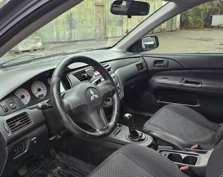 Сірий Міцубісі Lancer, об'ємом двигуна 1.58 л та пробігом 200 тис. км за 1700 $, фото 12 на Automoto.ua