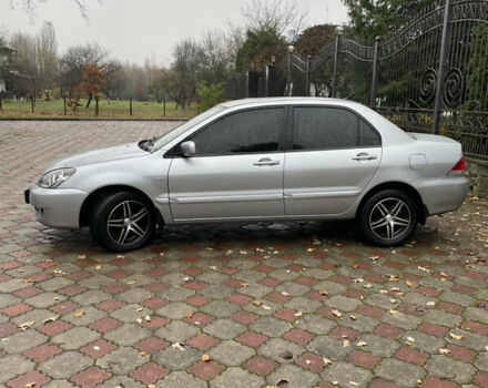 Сірий Міцубісі Lancer, об'ємом двигуна 1.59 л та пробігом 219 тис. км за 4500 $, фото 8 на Automoto.ua