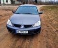 Сірий Міцубісі Lancer, об'ємом двигуна 1.6 л та пробігом 265 тис. км за 4300 $, фото 1 на Automoto.ua