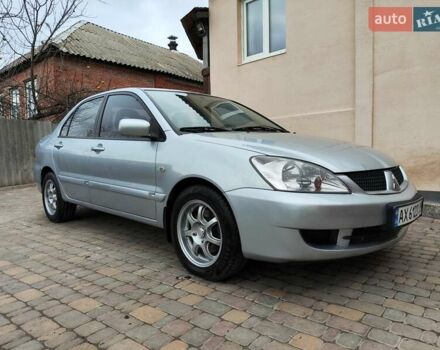 Серый Мицубиси Лансер, объемом двигателя 1.58 л и пробегом 185 тыс. км за 4700 $, фото 16 на Automoto.ua