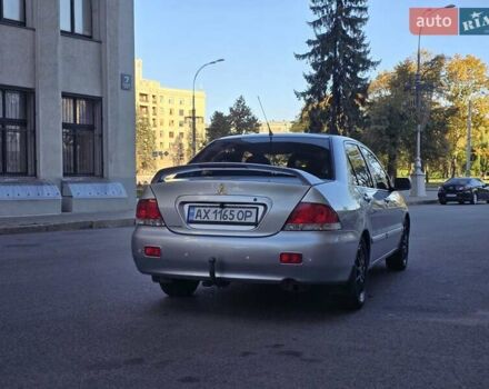 Серый Мицубиси Лансер, объемом двигателя 1.58 л и пробегом 150 тыс. км за 5200 $, фото 1 на Automoto.ua
