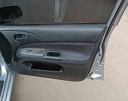 Серый Мицубиси Лансер, объемом двигателя 1.58 л и пробегом 176 тыс. км за 5000 $, фото 12 на Automoto.ua