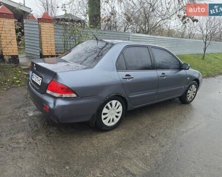 Сірий Міцубісі Lancer, об'ємом двигуна 1.58 л та пробігом 298 тис. км за 3400 $, фото 4 на Automoto.ua