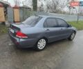 Сірий Міцубісі Lancer, об'ємом двигуна 1.58 л та пробігом 298 тис. км за 3400 $, фото 4 на Automoto.ua