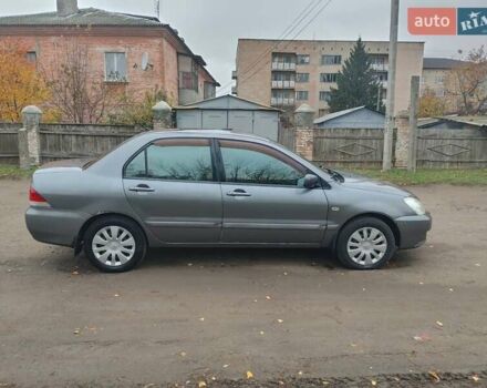 Сірий Міцубісі Lancer, об'ємом двигуна 1.58 л та пробігом 1 тис. км за 2850 $, фото 6 на Automoto.ua