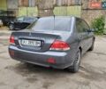 Серый Мицубиси Лансер, объемом двигателя 1.58 л и пробегом 200 тыс. км за 1700 $, фото 4 на Automoto.ua