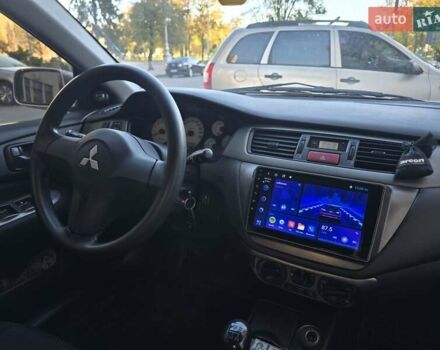 Серый Мицубиси Лансер, объемом двигателя 1.58 л и пробегом 150 тыс. км за 5200 $, фото 6 на Automoto.ua