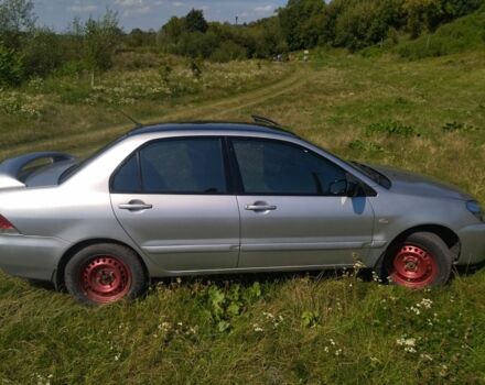 Серый Мицубиси Лансер, объемом двигателя 1.6 л и пробегом 350 тыс. км за 3600 $, фото 1 на Automoto.ua