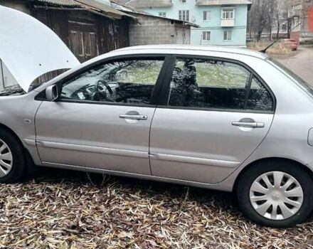 Серый Мицубиси Лансер, объемом двигателя 1.58 л и пробегом 89 тыс. км за 7500 $, фото 2 на Automoto.ua