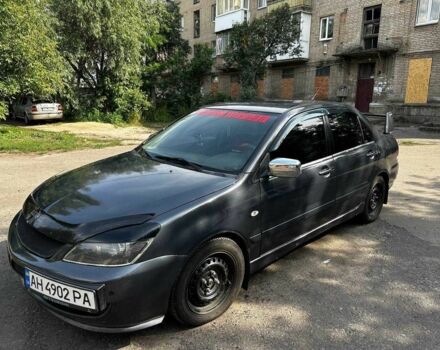 Серый Мицубиси Лансер, объемом двигателя 1.6 л и пробегом 999 тыс. км за 3200 $, фото 1 на Automoto.ua